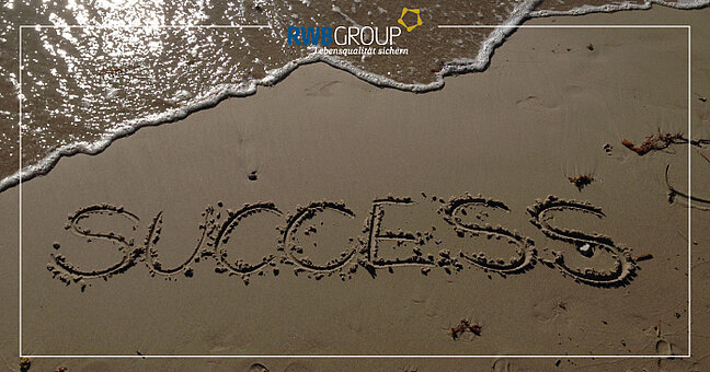 am Strand, Success in den Sand geschrieben
